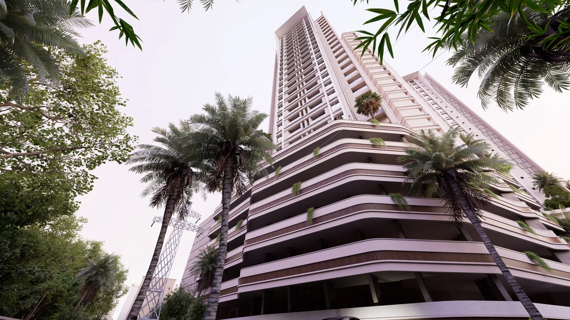 Low-angle street view of the Vumee Amrapalli tower with palm trees and curved podium levels
